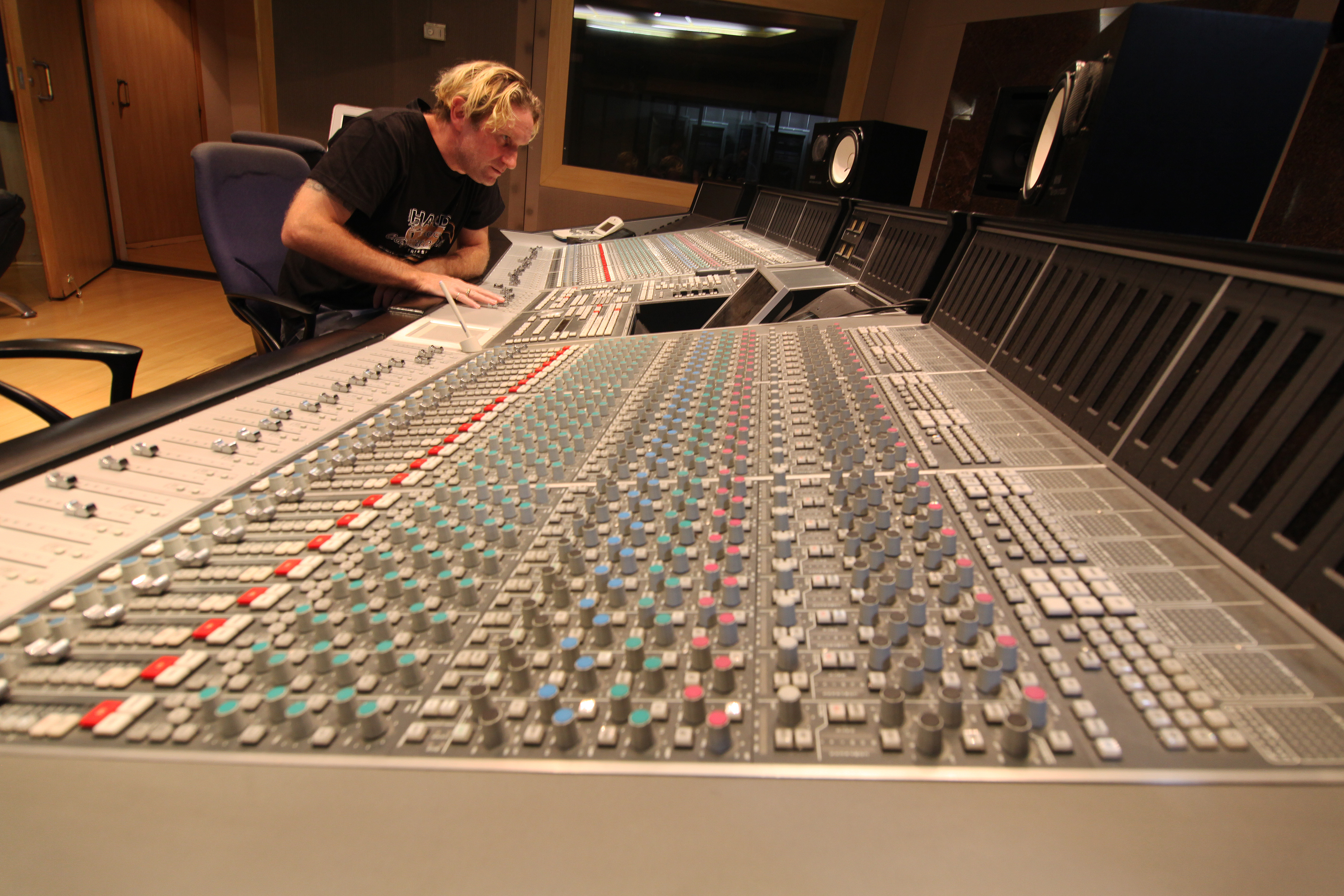 Cristiano Stern working at a mixing console at Mosh Studios, São Paulo, 2014